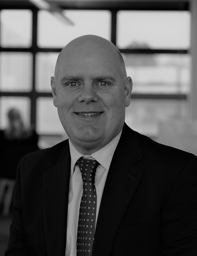 black and white photograph of a man in a business suit